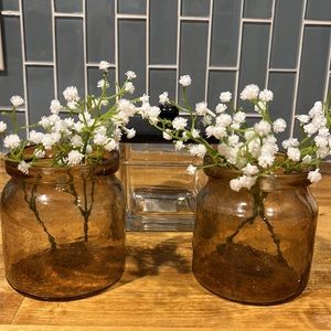 Three amber glass storage jars